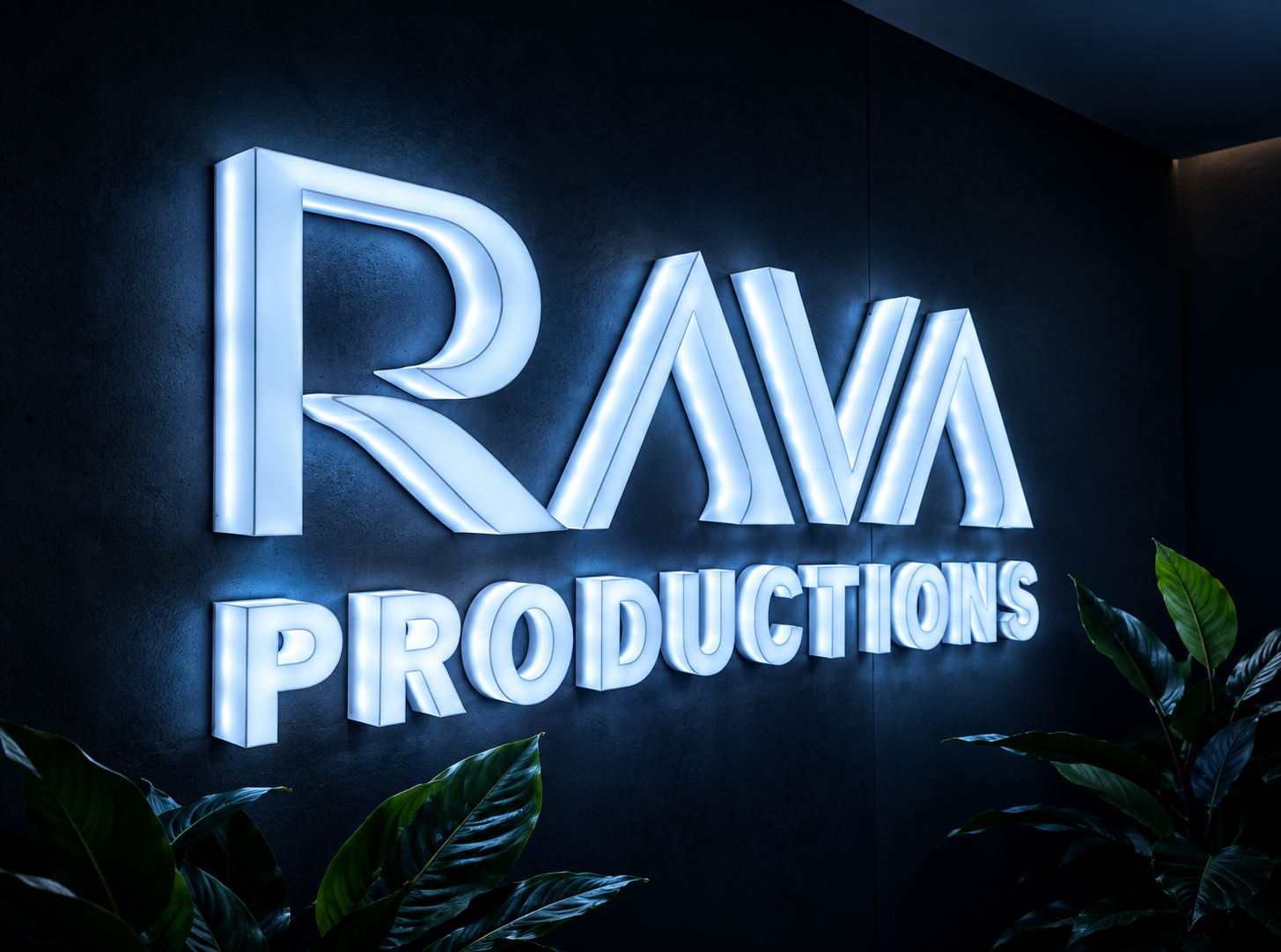 The illuminated Rava Productions sign on the studio wall